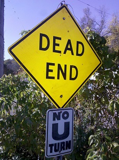 [Dead End sign above No U Turn sign.]