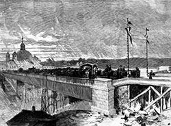 El primitivo viaducto de hierro y madera, en un grabado de 1874. Al fondo, se observa la Basílica de San Francisco el Grande.