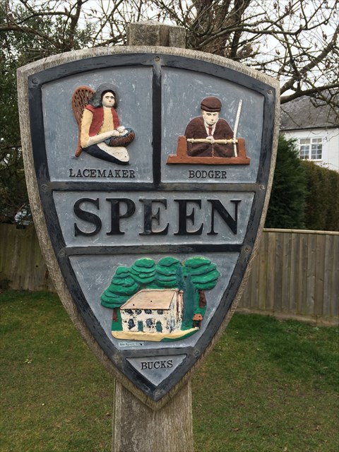 Speen village sign showing lacemaker and bodger