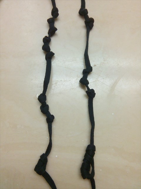 two quipu cords that encode the last three digits of longitude and latitude
