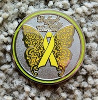 Front side of Defeat Kids Cancer geocoin