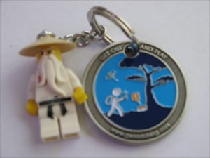 Lego Character attached to Get Out &amp; Play Geocoin