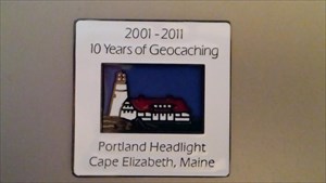 13coach13&#39;s Portland Headlight Geocoin (front)