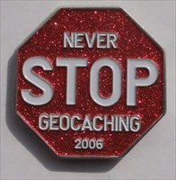 Never Stop Geocaching 2006 Geocoin glitter front
