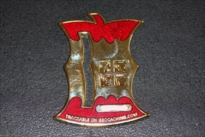 Take a Bite Geocoin gold red front