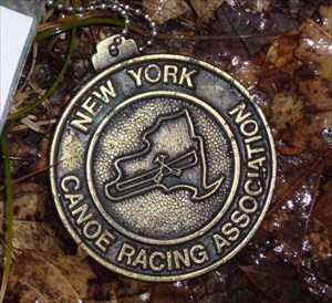 Curly&#39;s Canoe Championship Medal Travel Bug
