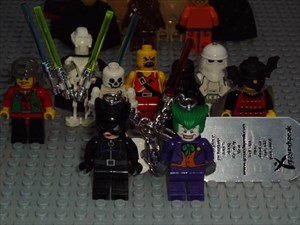 Catwoman and The Joker with other bad guys.