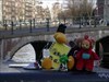 Group shot A group shot on an Amsterdam canal in January, including: &quot;Jewel Bug&quot;, &quot;Earl the Ey Up Mi Duck&quot;, &quot;Bare Love Travel Bug, &quot;Green M&amp;M, &quot;TrackBall Explorer&quot;, &quot;TravelTubby&quot;, &amp; &quot;To Teach His Own&quot;.
