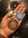 In the hands of a friend:) Hanging out with my two new Geo coins :)