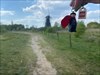 Na een rondje om de molen vliegt Superman met ons mee.  Log image uploaded from Geocaching® app