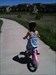 my daughter riding her bike, while out caching