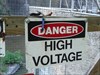 High Voltage No, don&#39;t go beyond this sign for the cache!  Beyond here it&#39;s shocking!