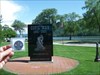Winona Memorial Geocoin in front of the Civil War Memorial marker in Winona, MN.