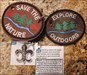 Jack's Scout Fleur de lis Trackable Proxy RE-RELEASED AS A PROXY WITH 2 OF ITS ORIGINAL HITCHHIKERS (WHICH WERE RETURNED TO ME) AFTER THE ORIGINAL TB ITSELF WENT MISSING FROM A CACHE WHERE THEY HAD BEEN PLACED OVER 15 MONTHS AGO. THEY HAD TRAVELED ABOUT 2,350 MILES BEFORE IT DISAPPEARED NEAR BIG FLATS, WISCONSIN!!