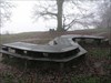 Big S-shaped table near the cache