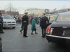 The Queen of England walking to her car