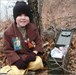 Eli with the Travel Bug Uptonhouse and Eli got the Maine Moose TB a little further south on his journey.