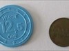 Två poletter 3 oktober, ena sidan One promotional &quot;coin&quot; - maybe from the 70&#39;s - in blue plastic and one token with forgotten purpose, added to the pouch Oct 3. This is the one side.