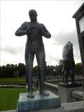 Image for Stående mann med knyttede hender mot brystet  -  Oslo, Norway