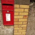 Image for Benchmark next to Red post box