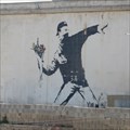 Image for Banksy graffiti: Man throwing flowers
