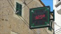Image for A Time and Temperature sign built into a sign advertising a pharmacy.