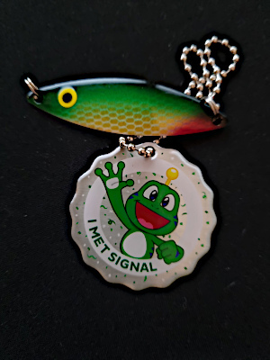 Green/Yellow/Red fishing lure with I met signal travelbug tag