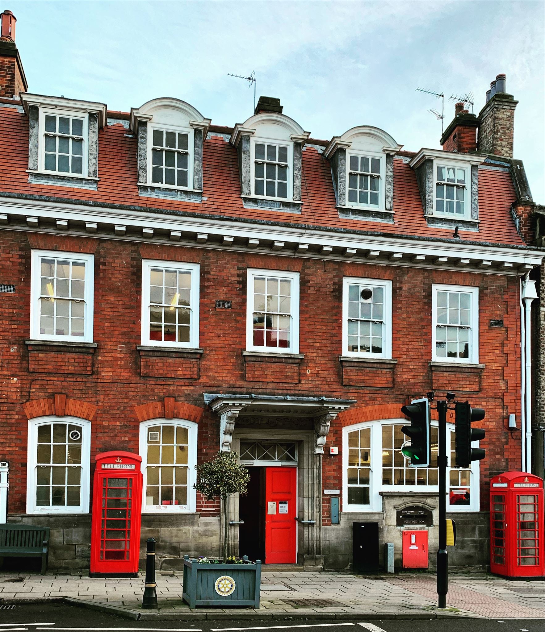A Fine Pair #1520. Post Office, Wheelgate Malton with 2 x red K6 telephone boxes and a red post box. c2020